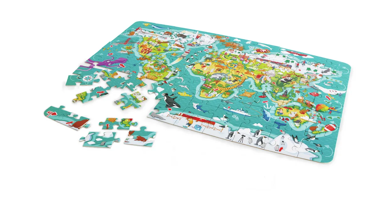 Puzzle Hape tour du monde en cours d'assemblage avec des pièces éparpillées autour de la carte
